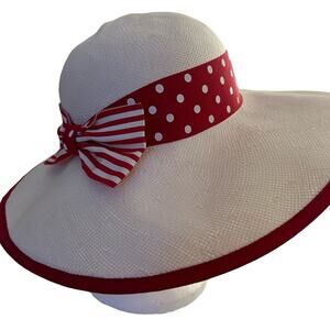 white straw women’s hat with red and white polka dot and striped ribbon